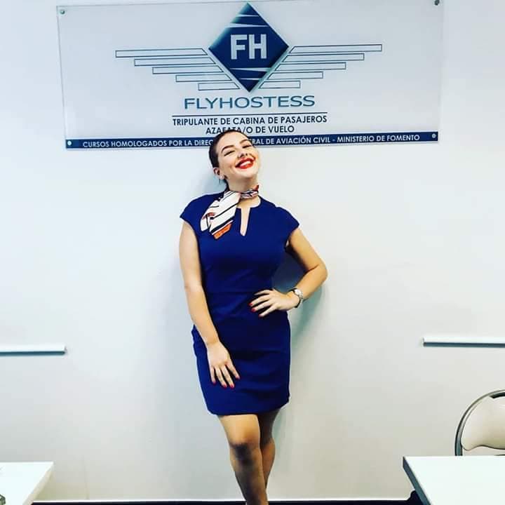 Profly Academy graduate posing at flight school